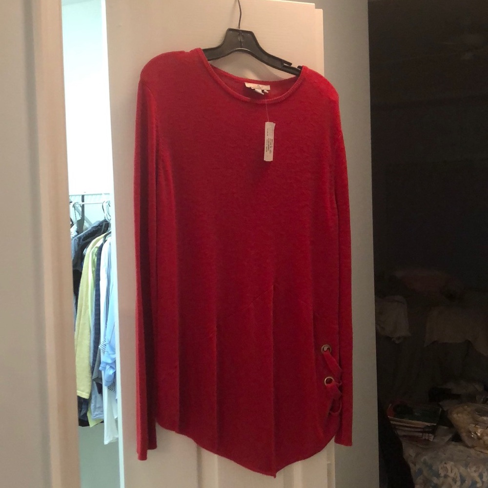 Brand new, never worn. Lighter weight sweater